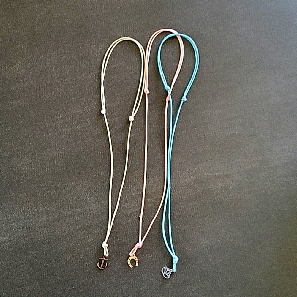 Set 3 charm necklaces, gold, silver, bronze w/ teal pink cream